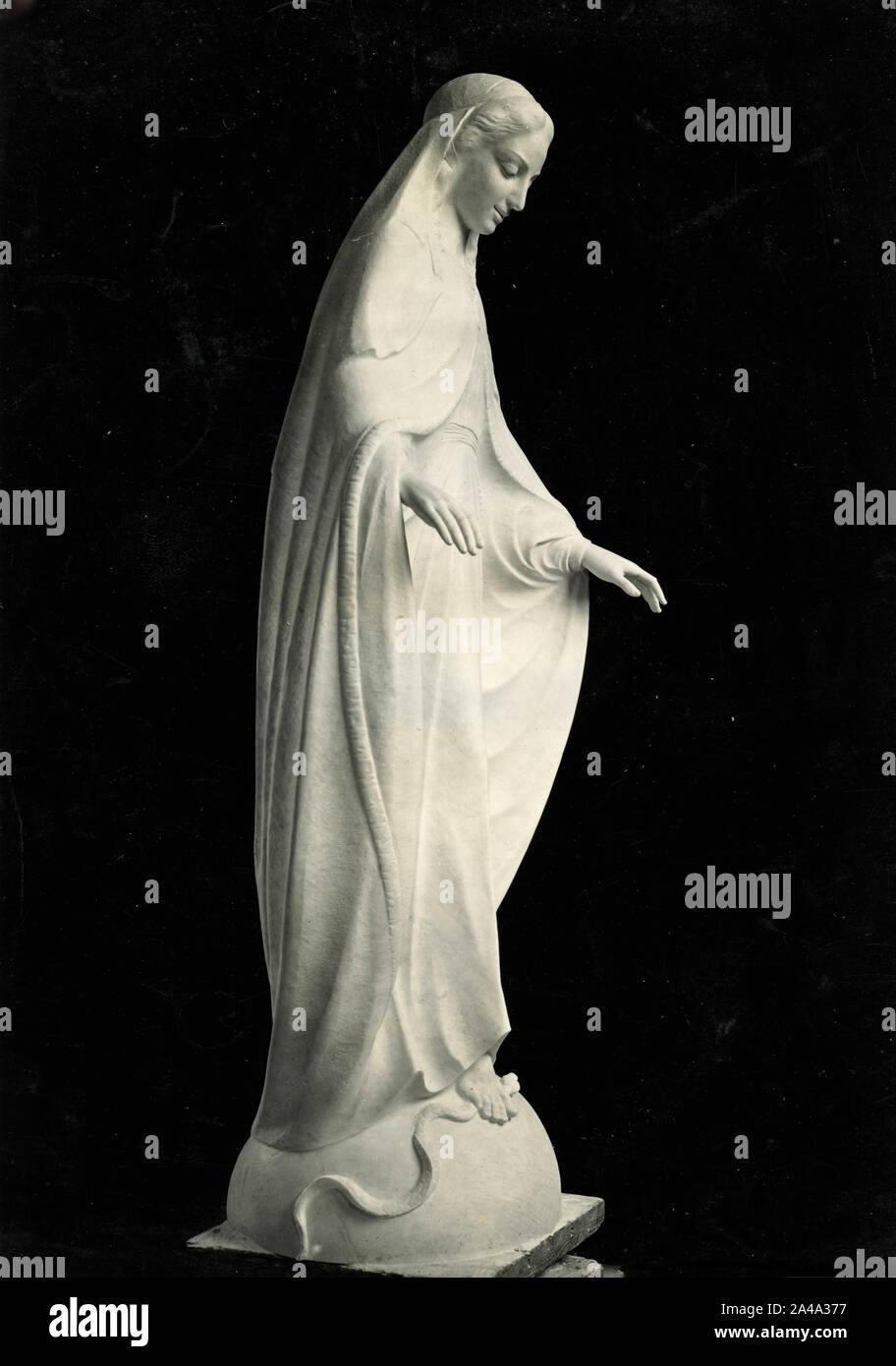The Virgin Mary crushes the snake, statue, 1950s Stock Photo Alamy