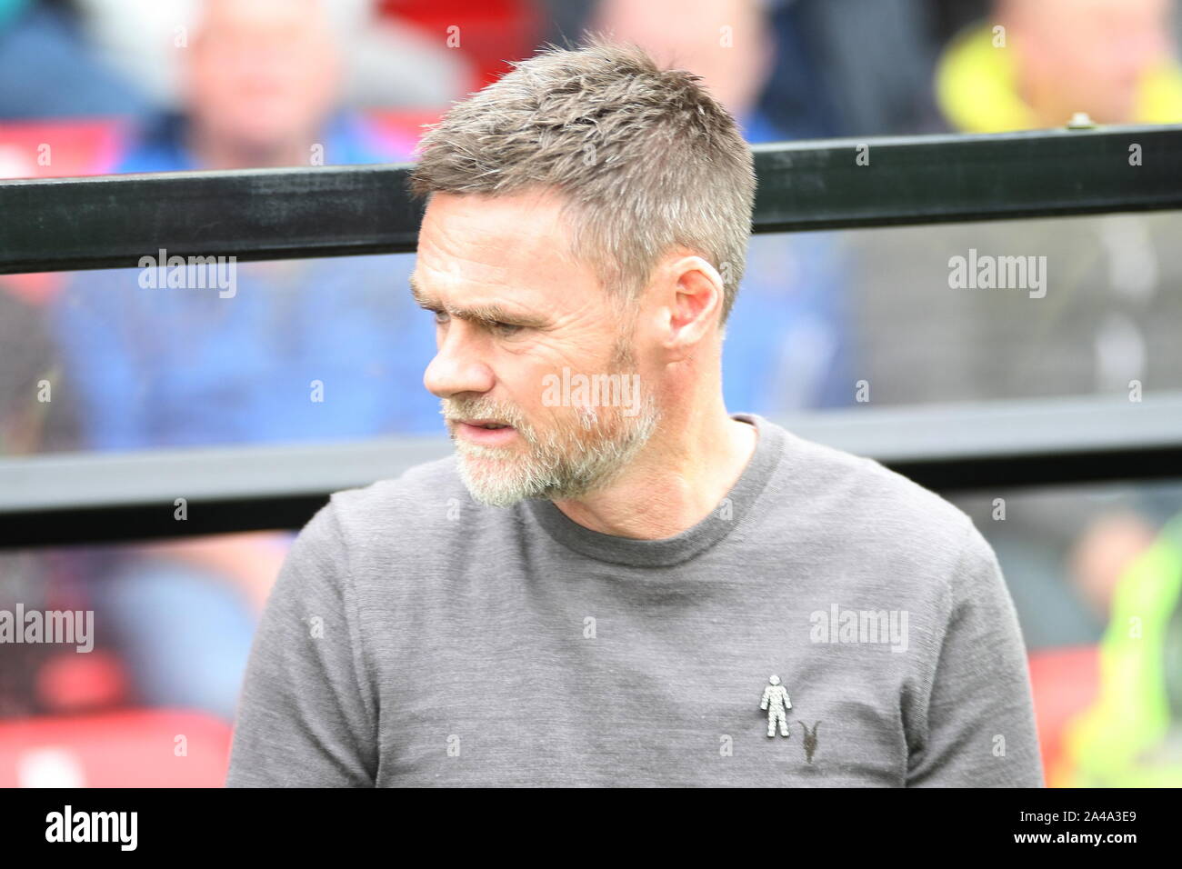 Salford, Greater Manchester, UK. 12th October, 2019. Salford City manager Graham Alexander in the dugout at The Peninsula Stadium ahead of the League Two clash with Cambridge United. Stock Photo