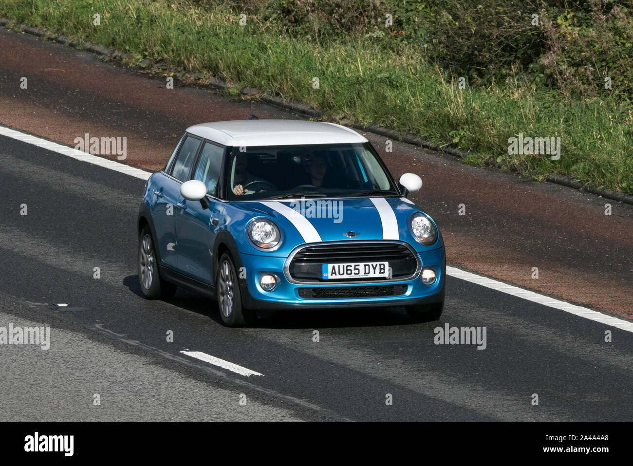 2015 blue Mini Cooper D; traveling on the M6 motorway near Preston in Lancashire, UK Stock Photo