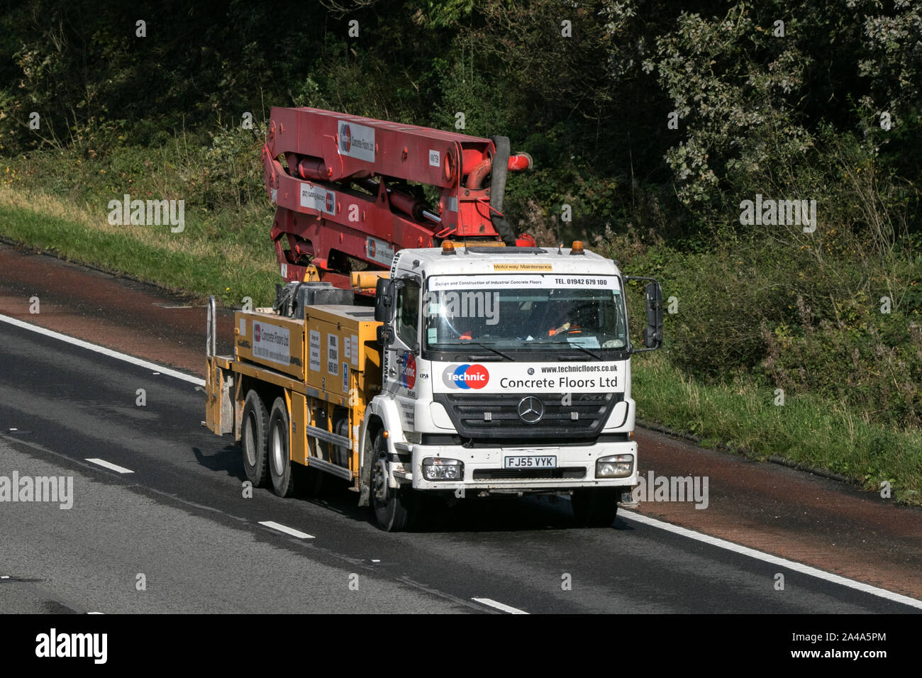 A Technic concrete floors Mercedes truck heading southbound on the M6 motorway near Preston in Lancashire, UK Stock Photo
