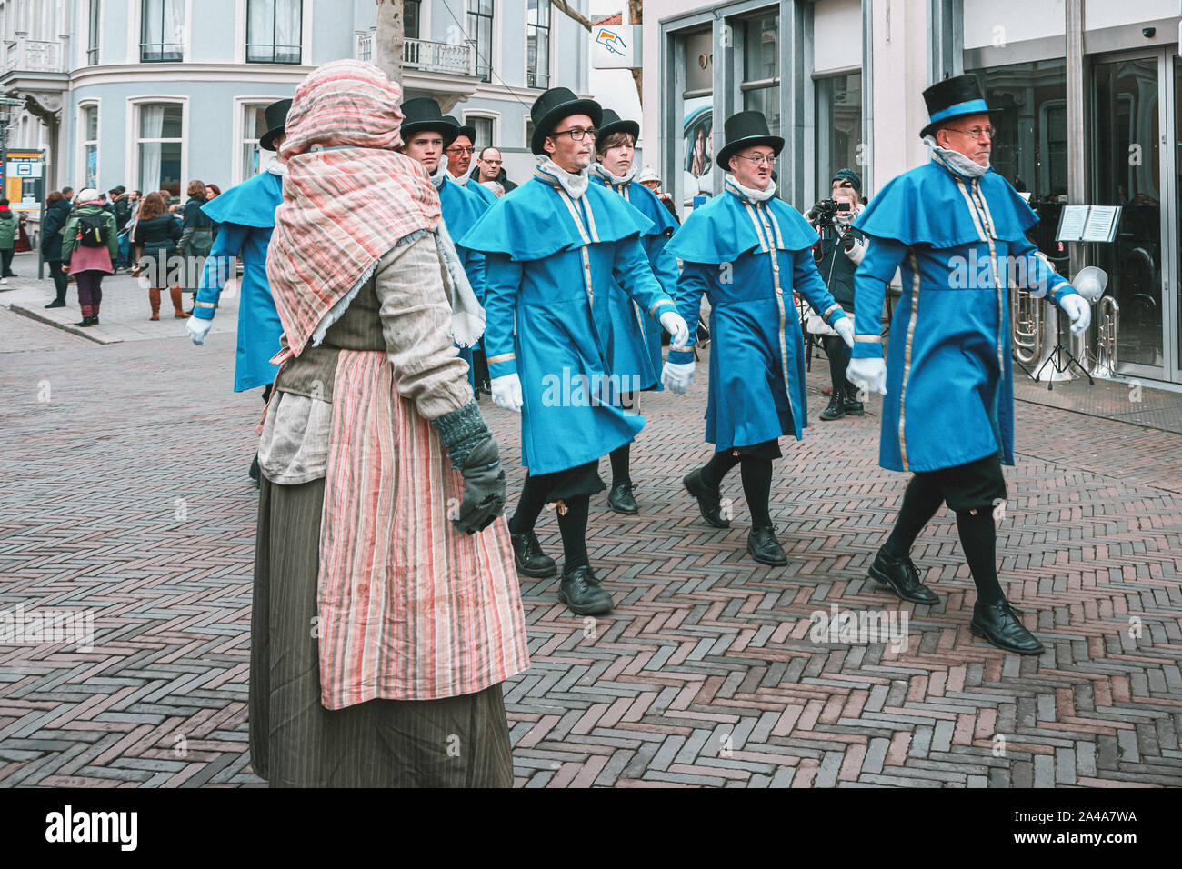 Deventer, Netherlands, December 15, 2018: Procession of men dressed in blue Victorian costume during the Dickens Festival in Deventer Stock Photo