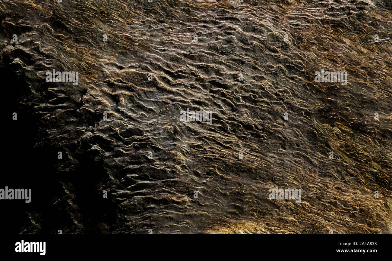Sedimentary sandstone textured and coloured background Stock Photo