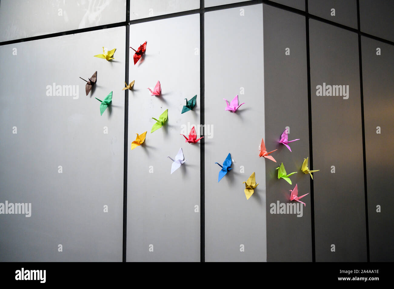 Wan Chai Hong Kong 12th Oct, 2019. Peaceful demonstrations continue in Hong Kong.  The silver hair 48 hour sit in of senior citizens starting on October 12th  outside police headquarters in Wan Chai. .Paper cranes adorn the wall of the sit in location in front of WanChai police station Stock Photo