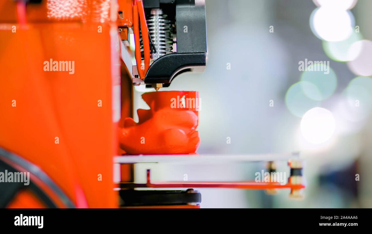 Three dimensional printing machine prints physical 3D model Stock Photo