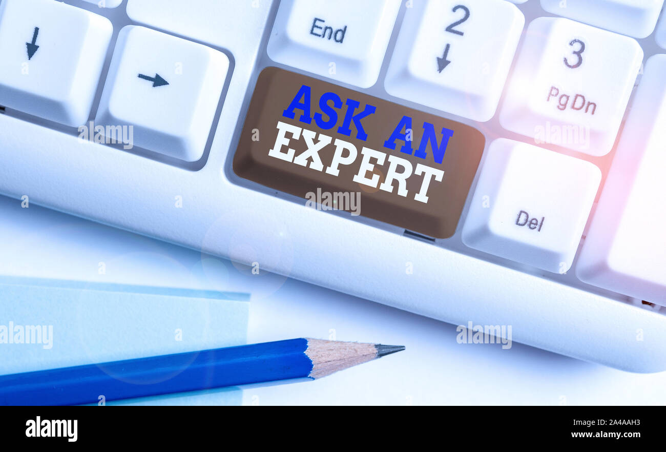 Conceptual hand writing showing Ask An Expert. Concept meaning consult someone who has skill about something or knowledgeable White pc keyboard with n Stock Photo