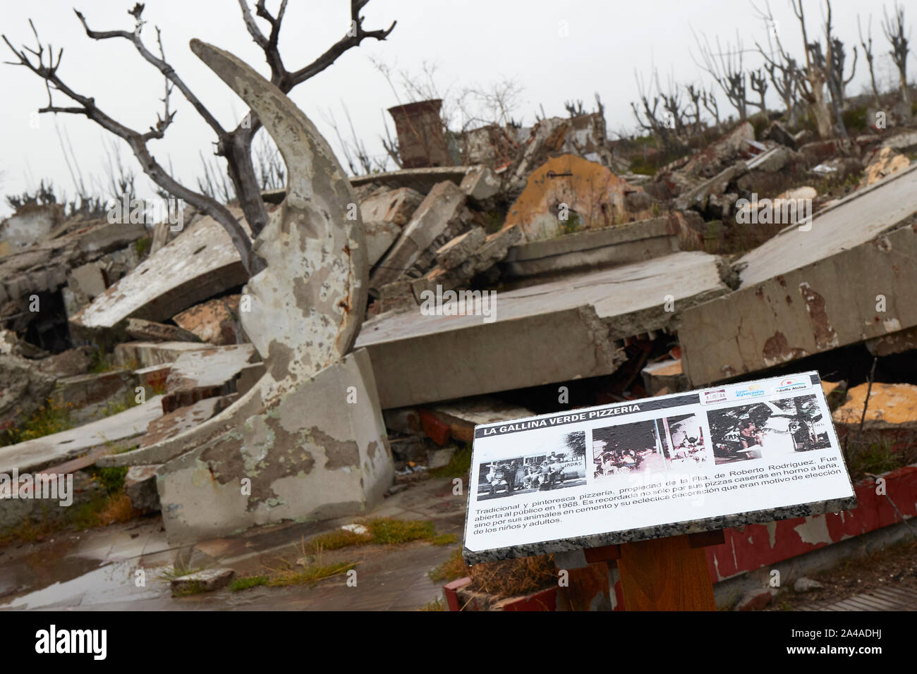 A cartel shows photos of a pizzeria, which used to be part of the tourist city of Villa Epecuen, now a pile of ruins. Buenos Aires province, Arg. Stock Photo