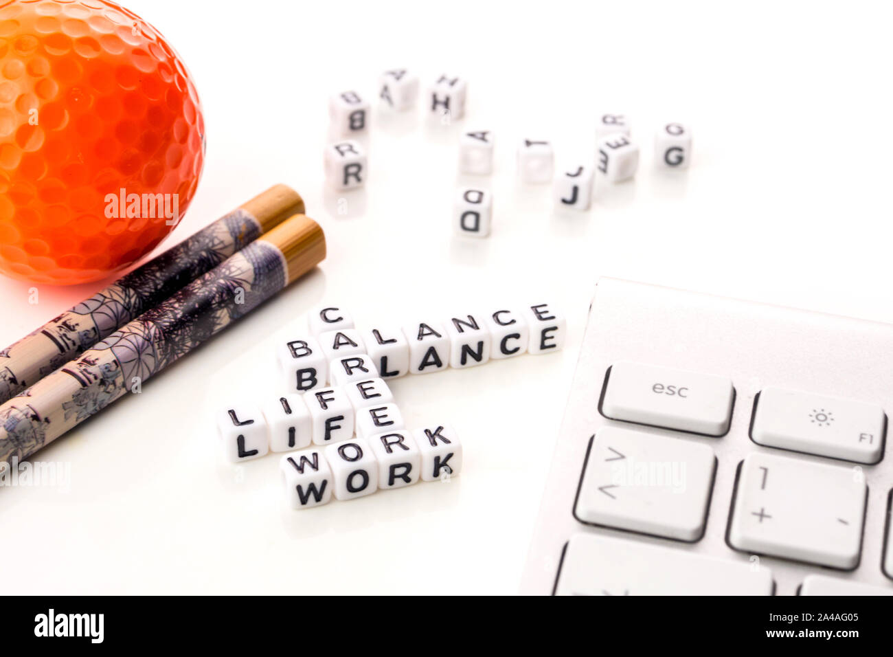 little white dices with black letters forming a crossword with the ...