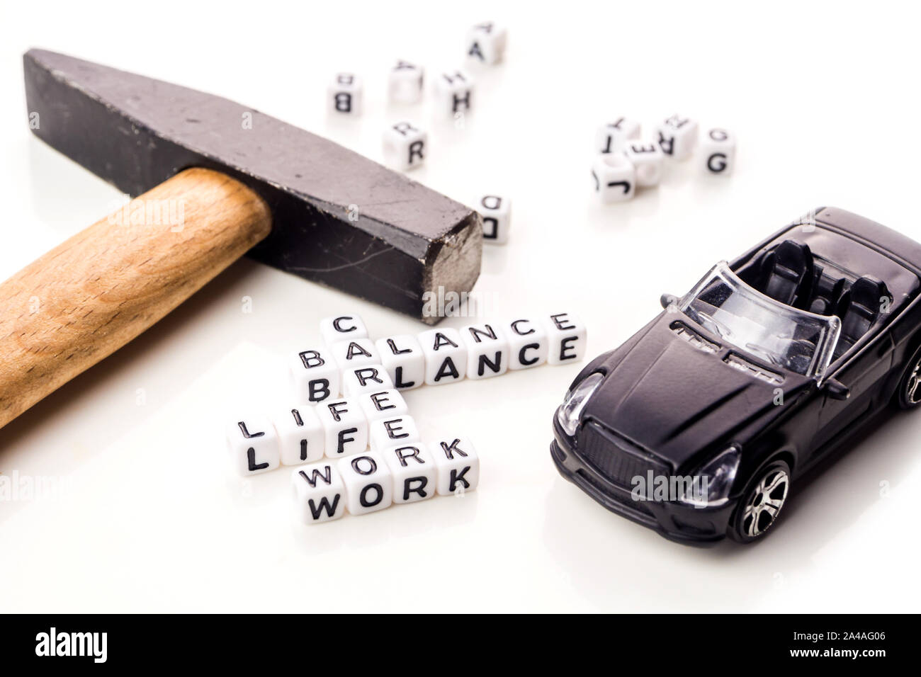 little white dices with black letters forming a crossword with the ...