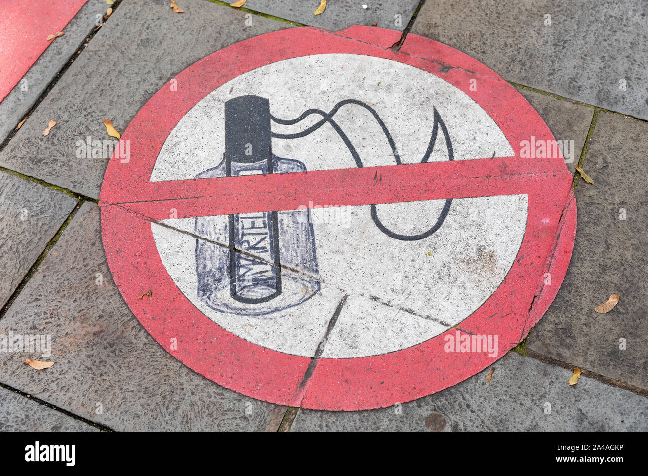 A no alcohol consumption sign painted onto the pavement on a private area on a city street Stock Photo