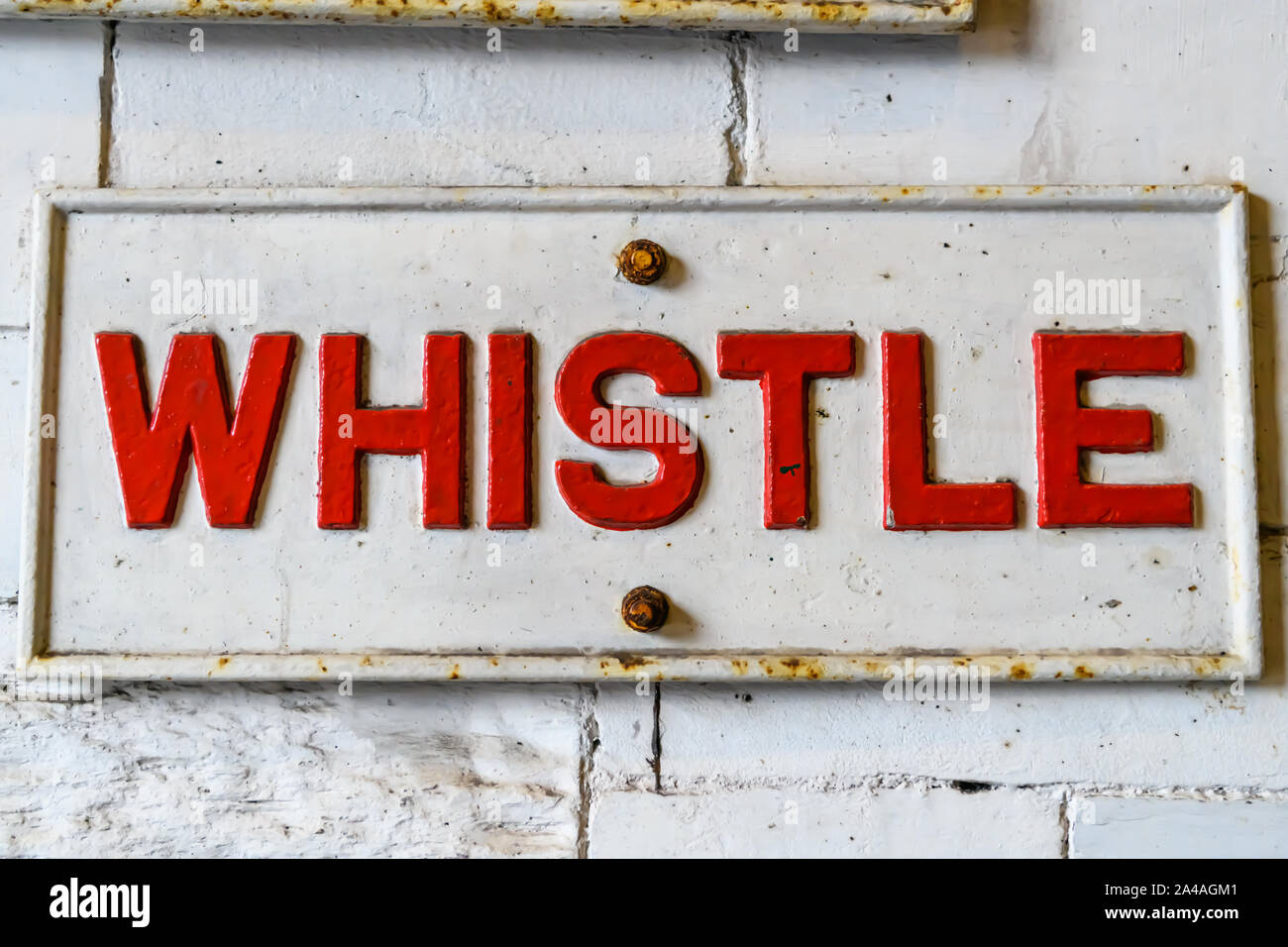 railway notice with the word whistle Stock Photo Alamy