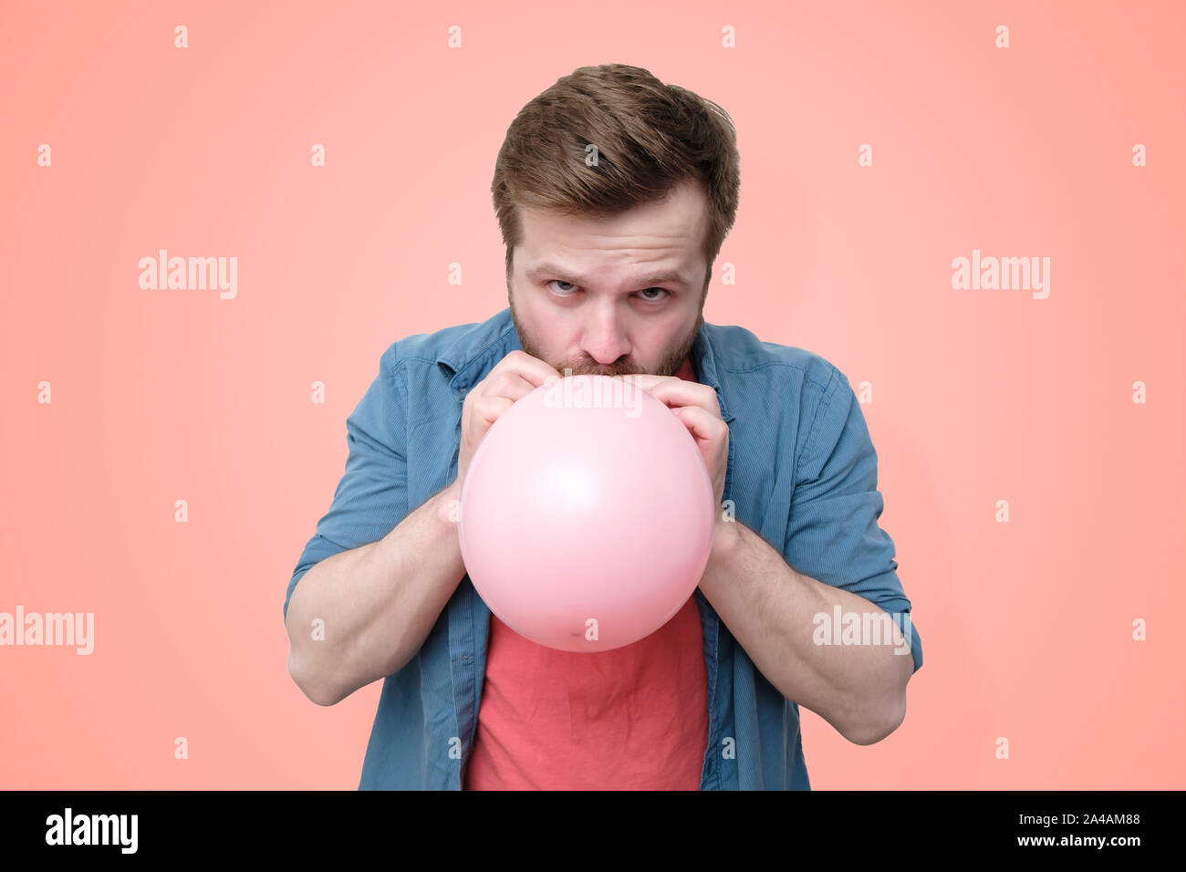 Close up man inflating pink hi-res stock photography and images - Alamy