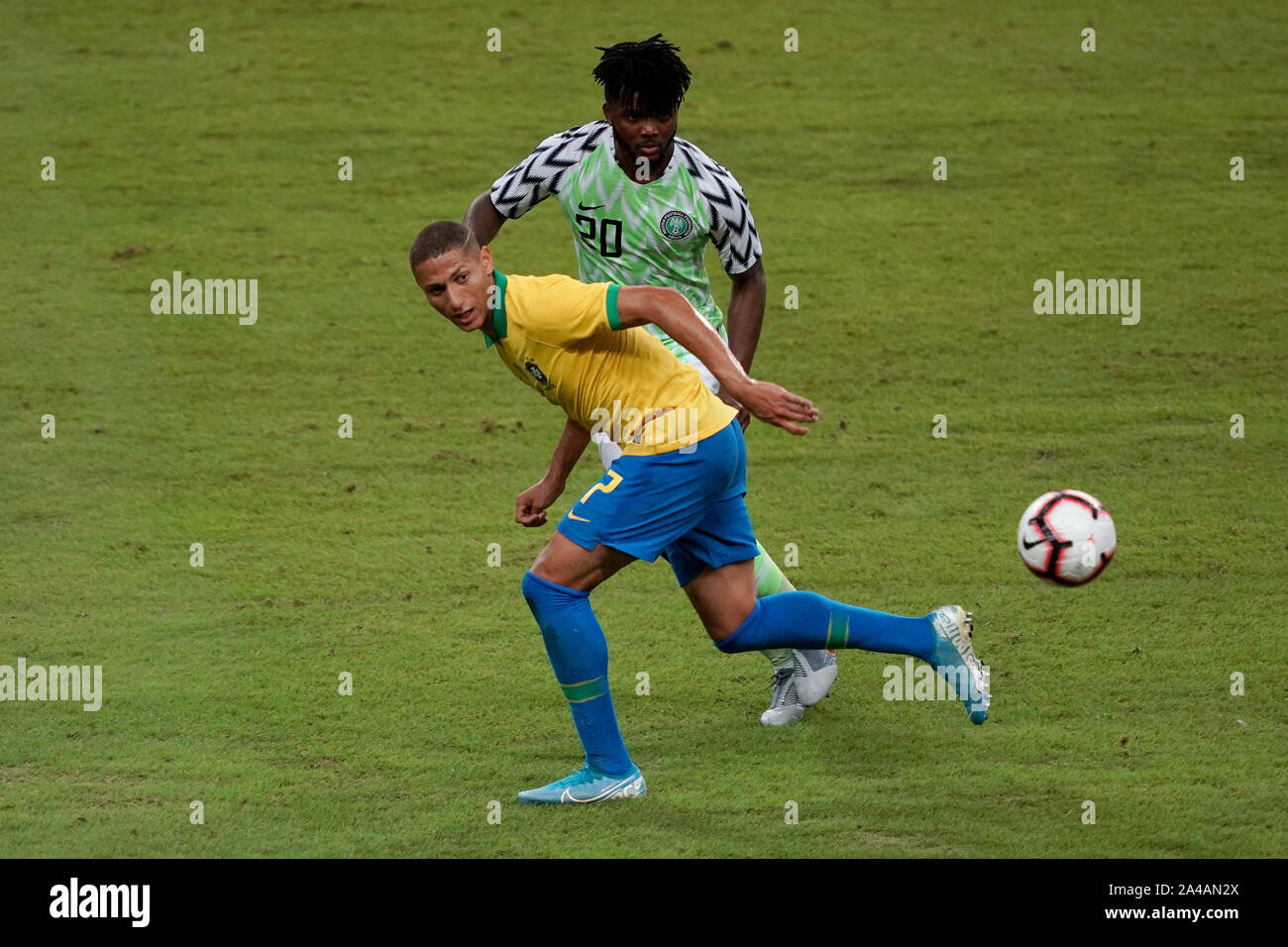 National Stadium Singapore, Singapore. 13th Oct, 2019. International Friendly, Brazil versus Nigeria; Richarlison of Brazil leaves the ball behind in a challenge with Chidozie Awaziem of Nigeria - Editorial Use Credit: Action Plus Sports/Alamy Live News Stock Photo