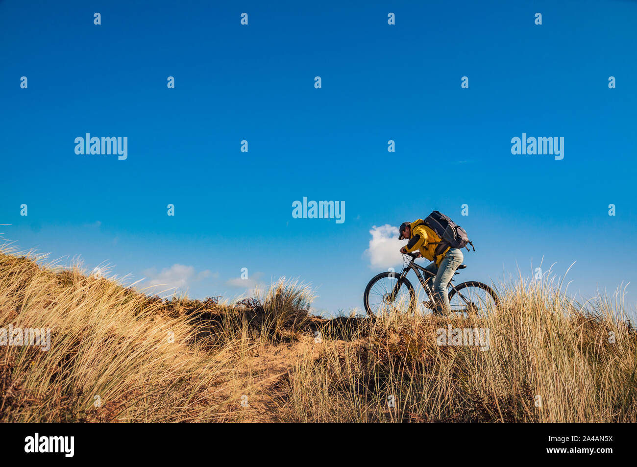 Cycling Ireland. Recreational cyclist with mountain bike and backpack