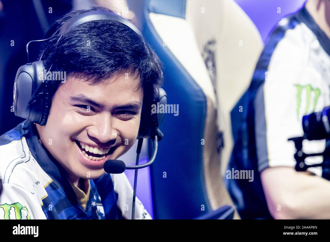 Berlin, Germany. 13th Oct, 2019. Jake 'Xmithie' Puchero, Philippine-US e-athlete at Team Liquid, laughs at the group stage of the League of Legends e-sports world championship at the Verti Music Hall before the start of the match. Credit: Christoph Soeder/dpa/Alamy Live News Stock Photo