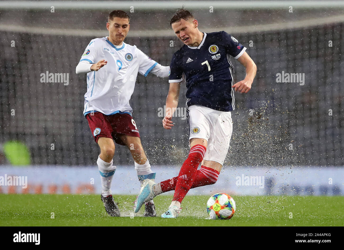 Scotland's Scott McTominay (right) and San Marino's Marcello Mularoni battle for the ball during the UEFA Euro 2020 qualifying match at Hampden Park, Glasgow. Stock Photo