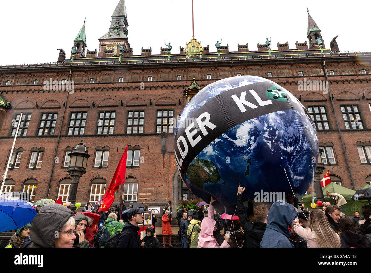 COPENHAGEN, DENMARK – OCTOBER 11, 2019:  Thousands of people gather at a People’s Climate March at Copenhagen City Hall Square and demanded swift and extensive climate action, which marks the conclusion of the C40 World Mayors Summit during this week in Copenhagen.  Alexandria Ocasio-Cortez, a US politician and climate activist, spoke at the demonstration. More than 90 mayors of some of the world’s largest and most influential cities representing some 700 million people met in Copenhagen from October 9-12 for the C40 World Mayors Summit. The purpose with the summit in Copenhagen was to build a Stock Photo
