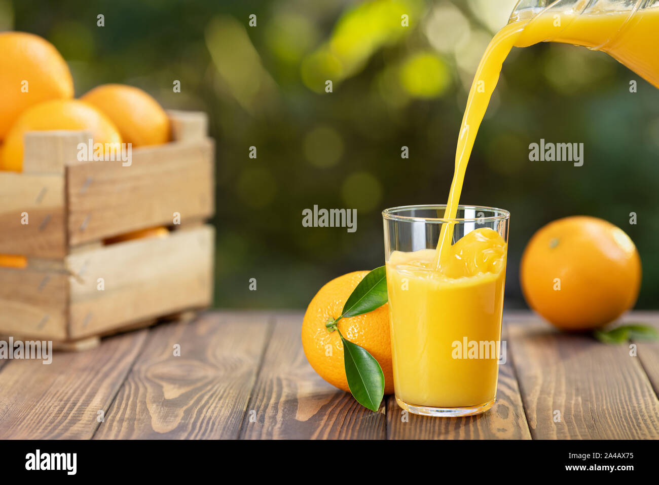 Pouring orange juice from a glass jug … – License Images – 138447 ❘  StockFood