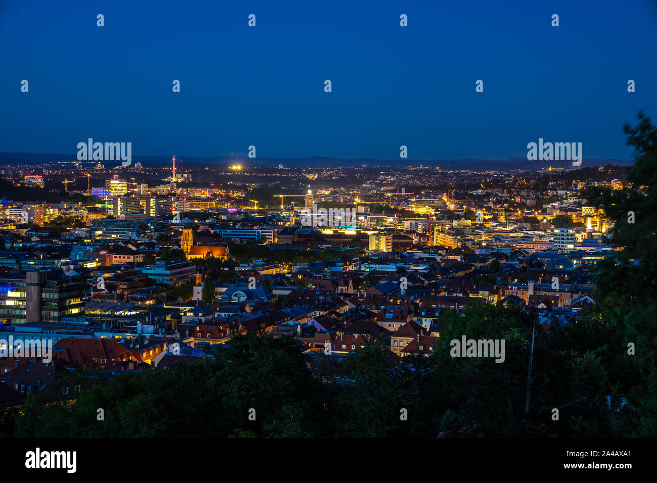 Germany, Night lights of illuminated skyline and cityscape of downtown ...
