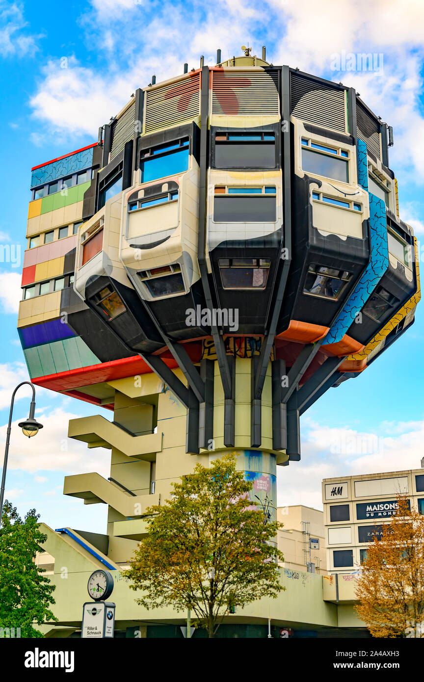 Berlin, Germany - October 5, 2019: Restaurant tower of the seventies from  painted concrete in a business street in Berlin-Steglitz against blue sky  Stock Photo - Alamy