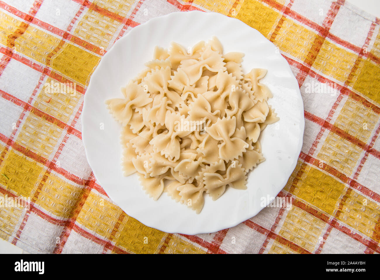 Fresh cooked farfalle pasta, served in dish without sauce Stock Photo