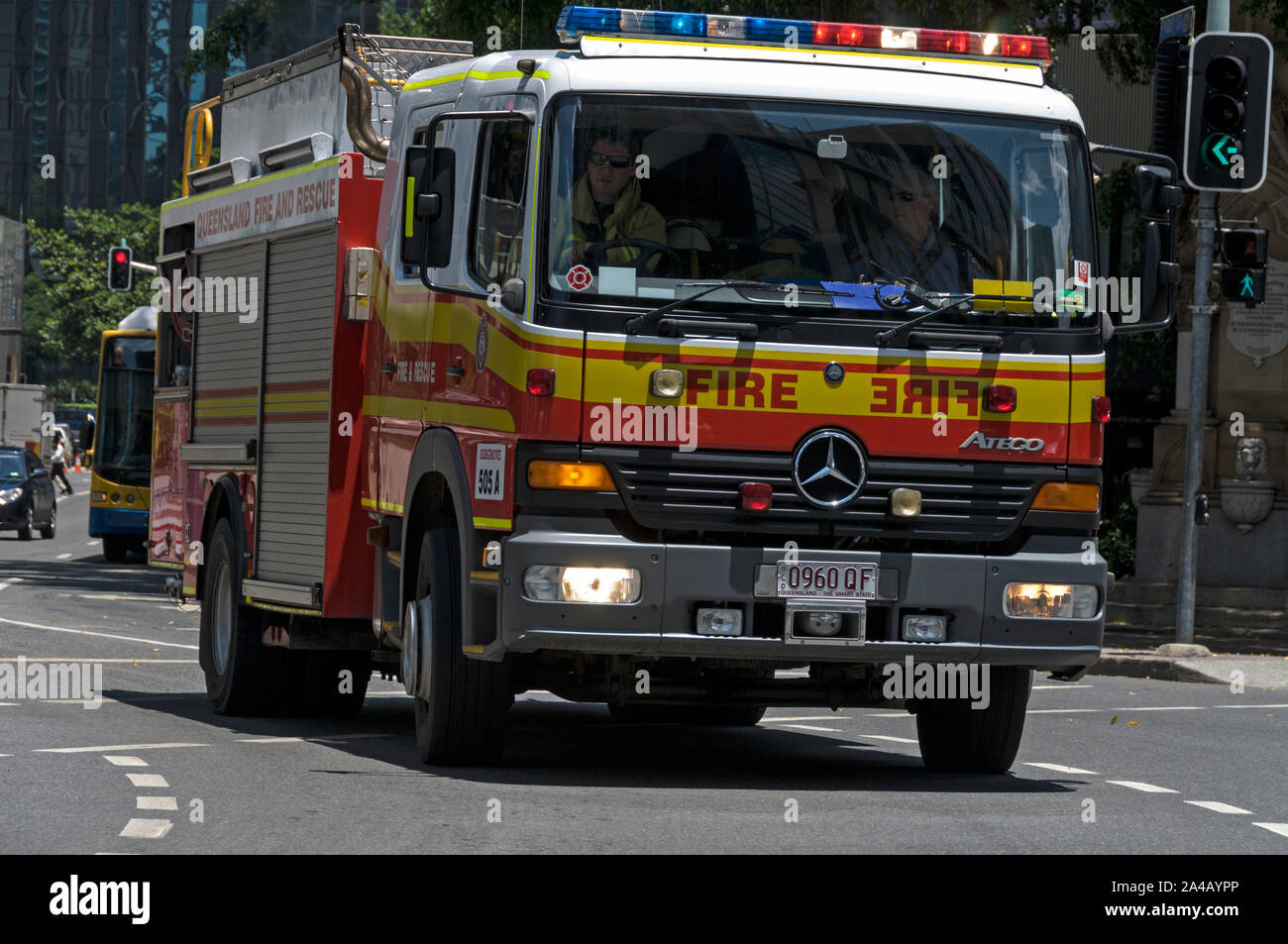 A Queensland Fire and Rescue appliance on an emergency call in one of
