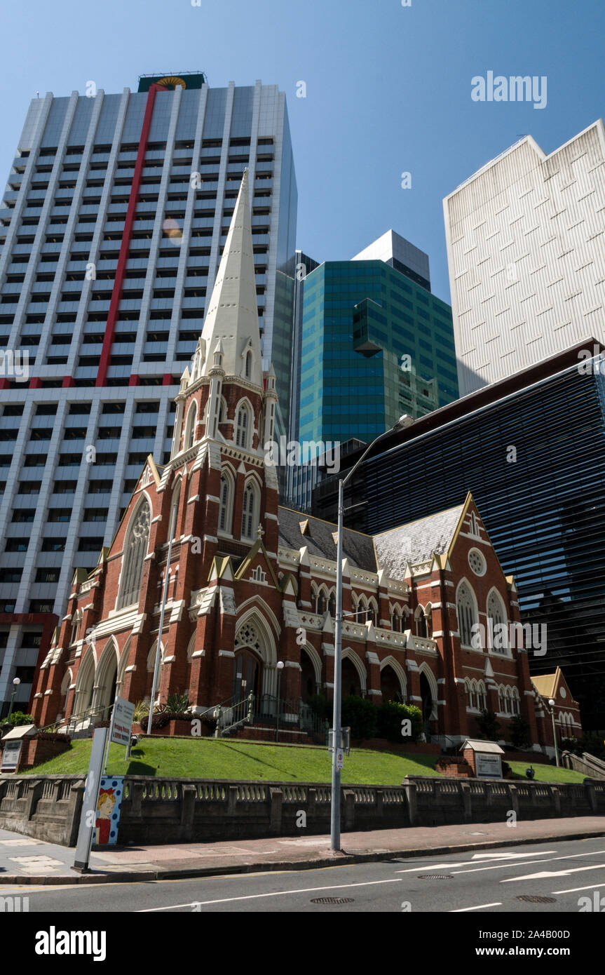 Albert Street Uniting Church,  a Wesley Church in Albert Street off King George Square, surrounded by modern office towers in Brisbane, Queensland, Au Stock Photo