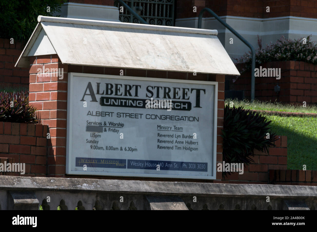 Albert Street Uniting Church a Wesley Church in Albert Street surrounded by modern office towers in Brisbane, Queensland,Australia Stock Photo