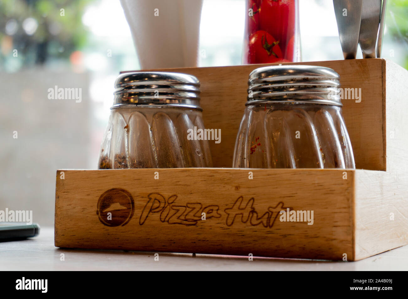 Wooden salt pepper oregano and chili flakes shaker and tissue holder at