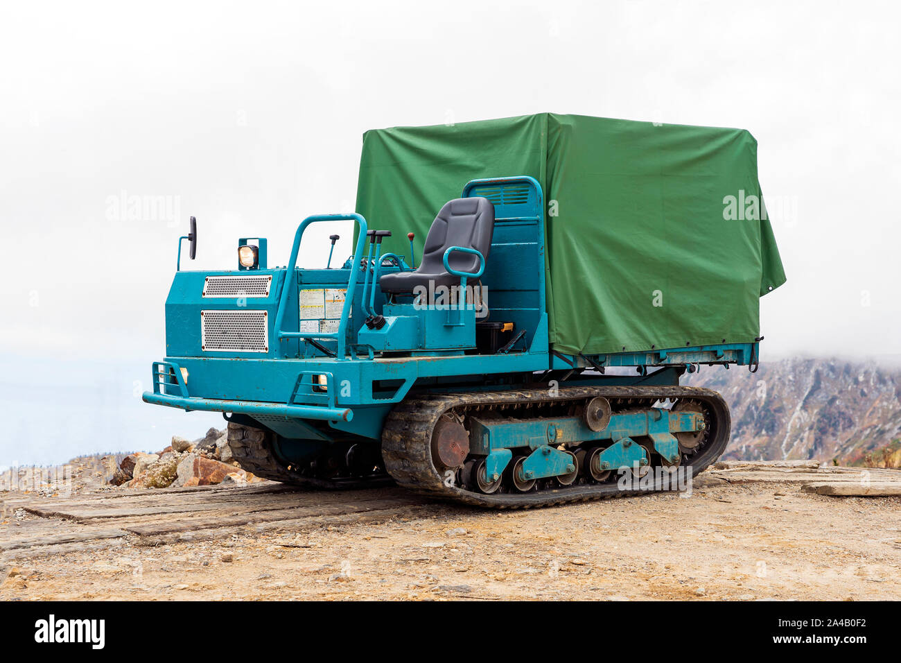Blue And Green The Land Rover. Cross Country All Terrain Vehicle Has Caterpillar Tracks. Stock Photo