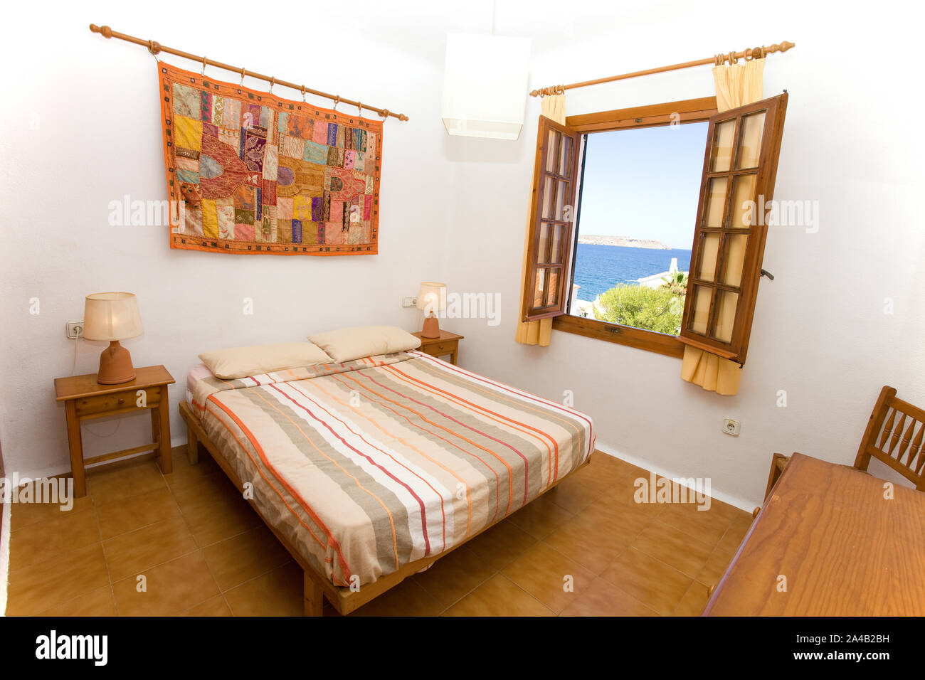 Spanish bed interior with sea view Stock Photo Alamy