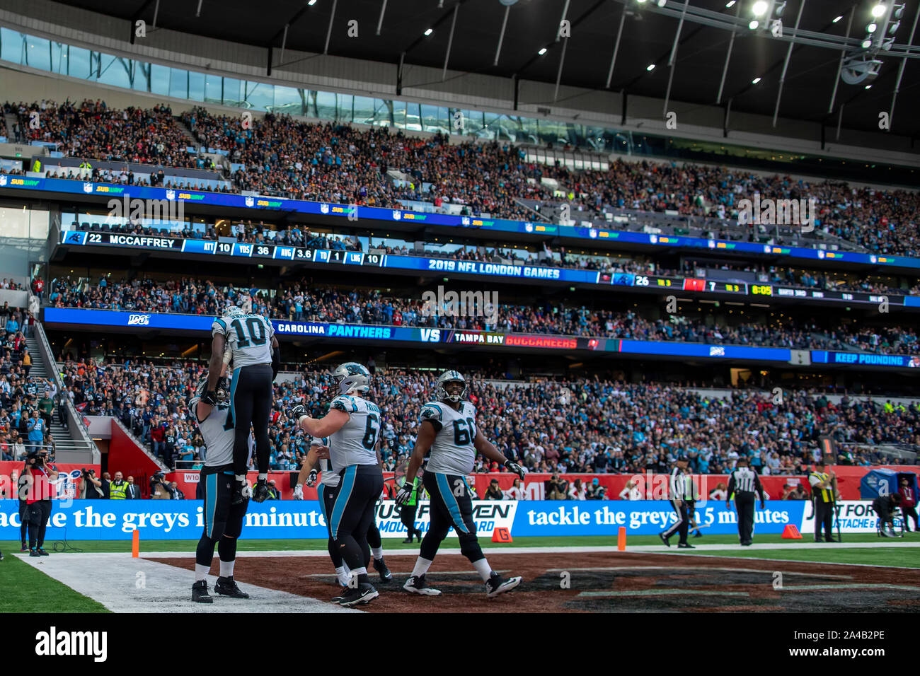 Tottenham Hotspur Stadium, London, UK. 13th Oct, 2019. National Football League, Carolina Panthers versus Tampa Bay Buccaneers; Carolina Panthers Wide Receiver Curtis Samuel (10) is held in the air as he scores a touch down -Editorial Use Credit: Action Plus Sports/Alamy Live News Stock Photo