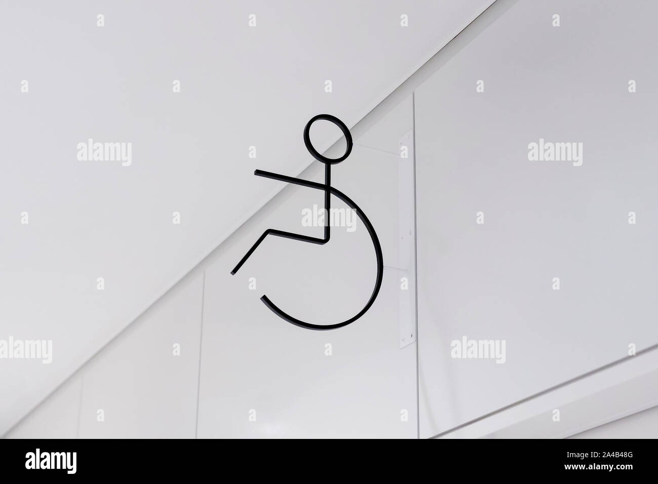 The Sign of Handicap's WC or Bathroom. Black Contour Line of the Toilet Icon for Disabled People. Silhouette of Man in the Wheelchair for the Restroom Stock Photo