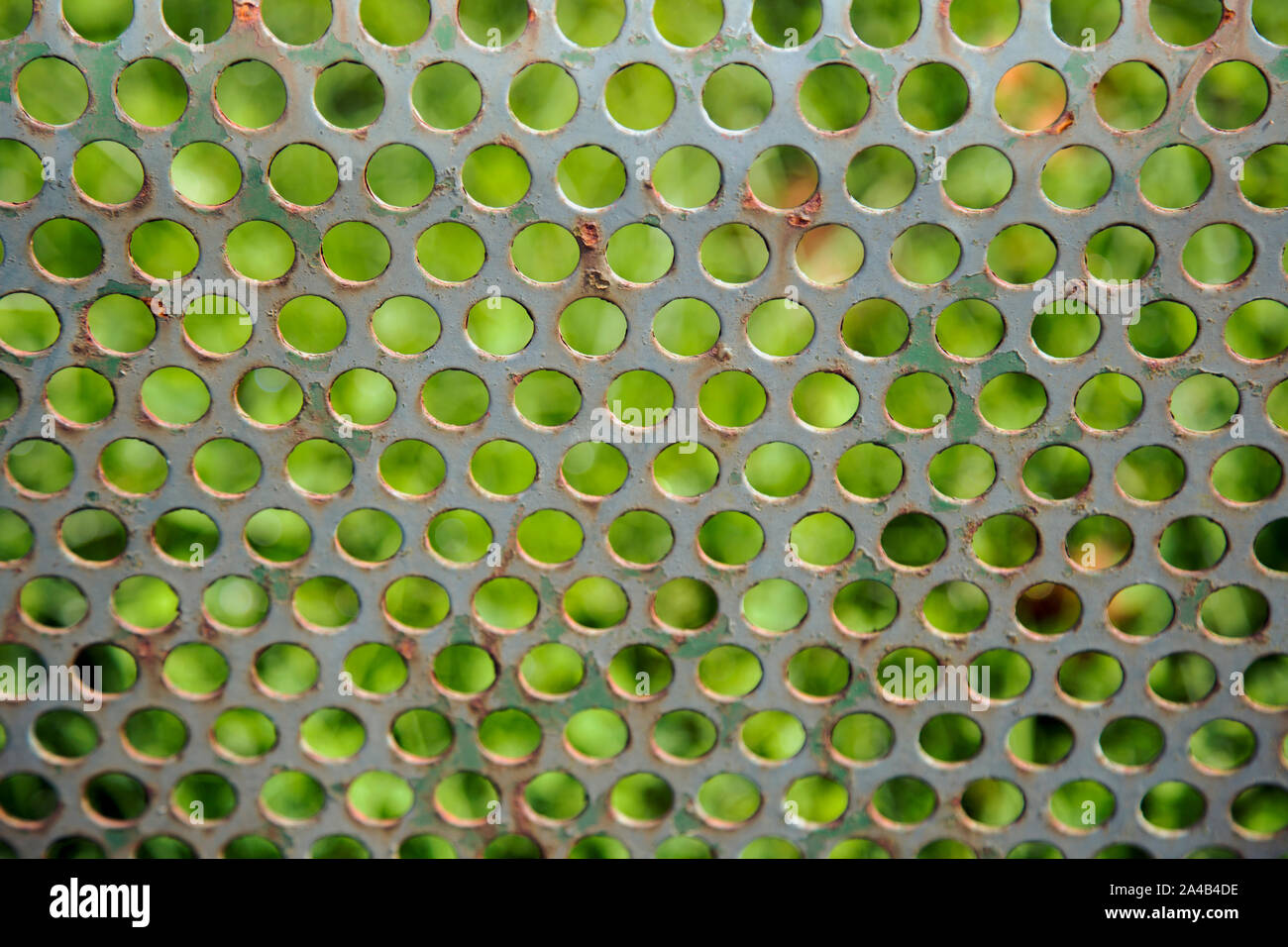 Perforated metal sheet photographed as a background Stock Photo