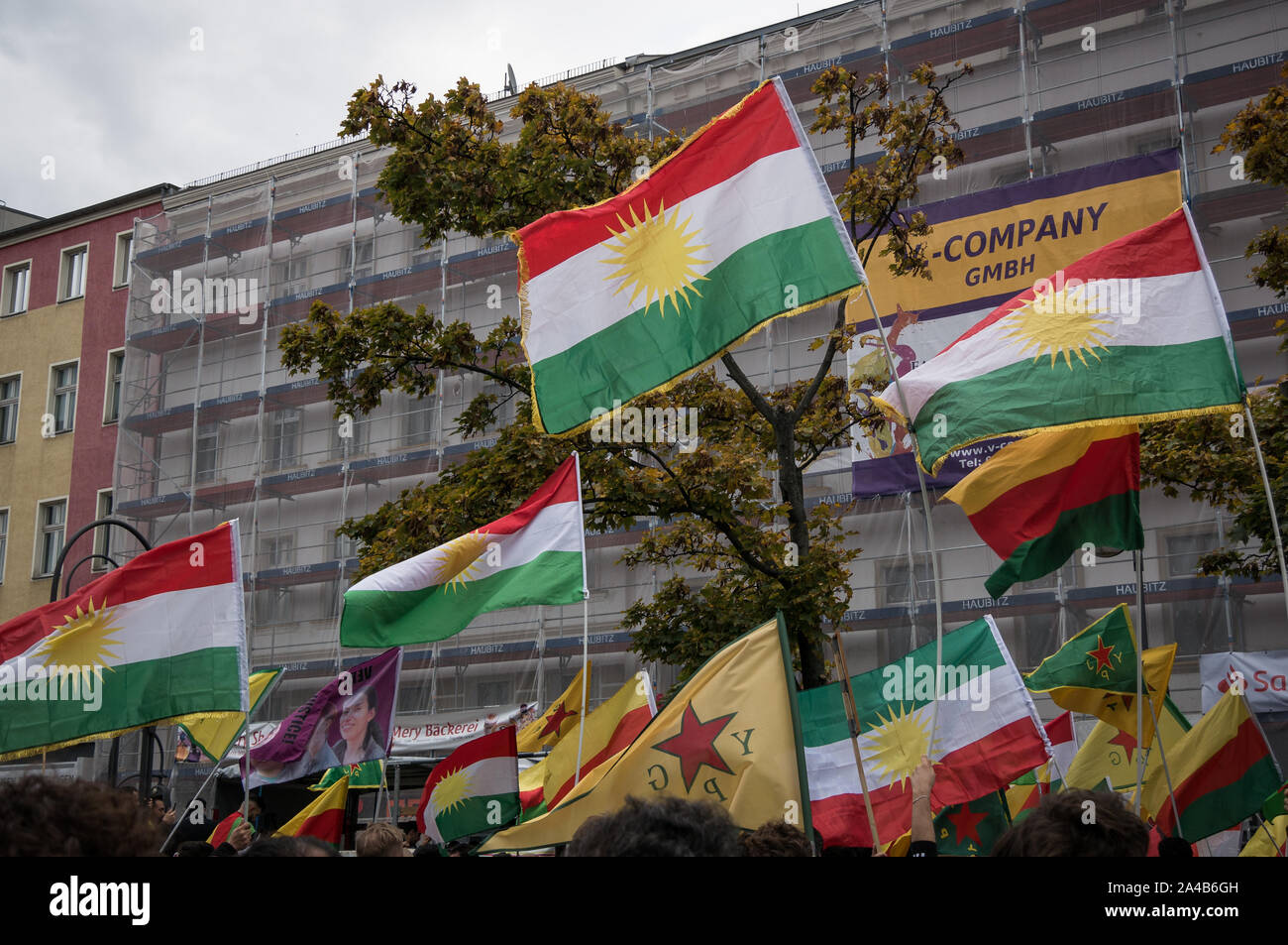Berlin/Germany, Oct 2019: Demostration and protest against Turkish offensive and aggressions in Syria against the Kurds, many kurdistan and ypg flags Stock Photo