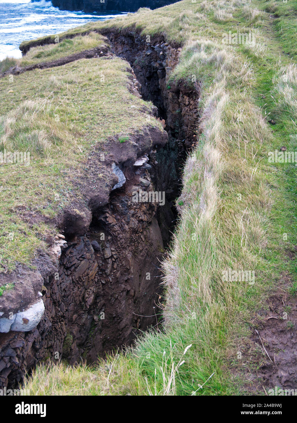 Land slipping before collapsing into the sea at Eshaness, Shetland, Scotland, UK Stock Photo