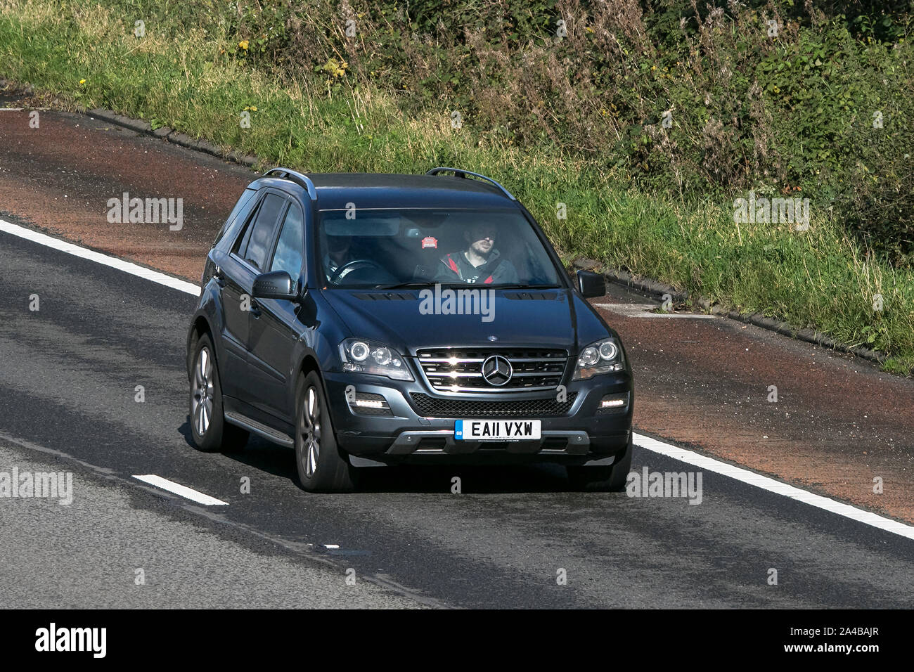 2011 Mercedes-Benz Ml350 GRD EDN CDI B-Eff A; traveling on the M6 motorway near Preston in Lancashire, UK Stock Photo