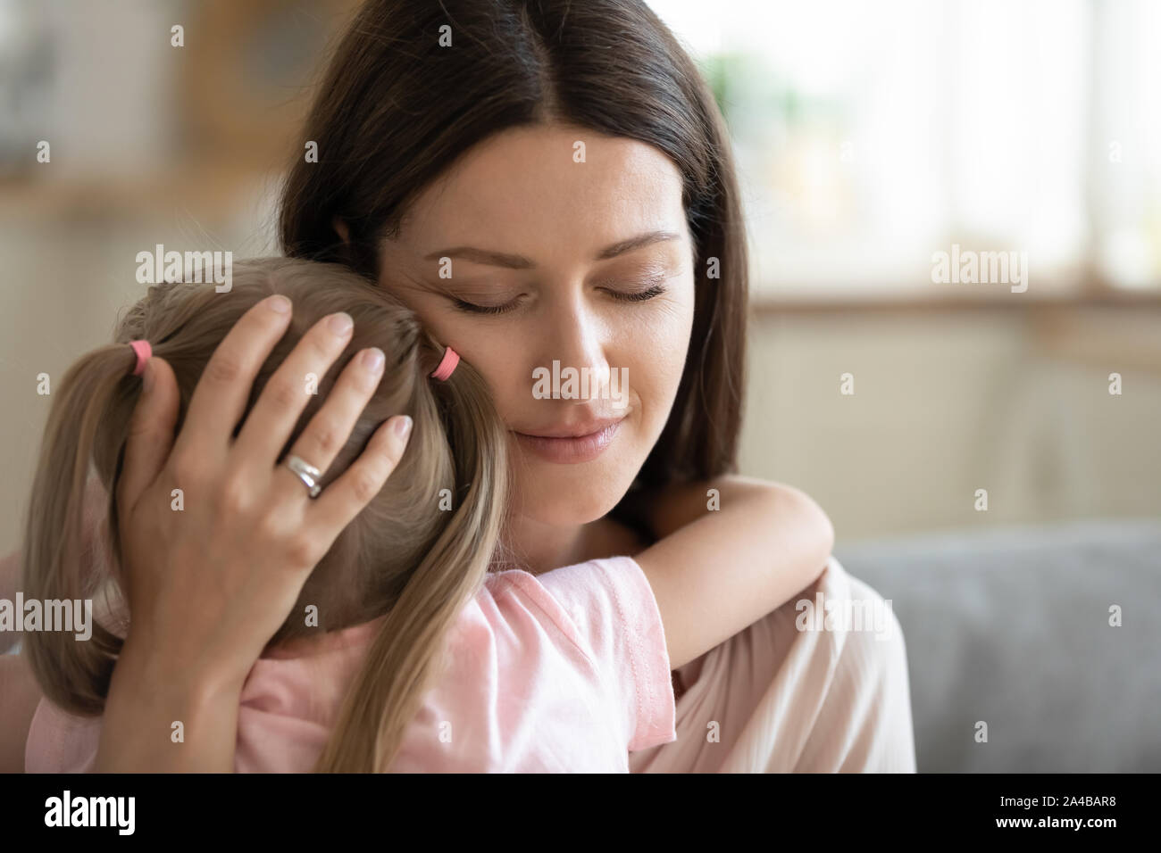 Happy Serene Mother Hugging Little Daughter With Love Close Up Stock 