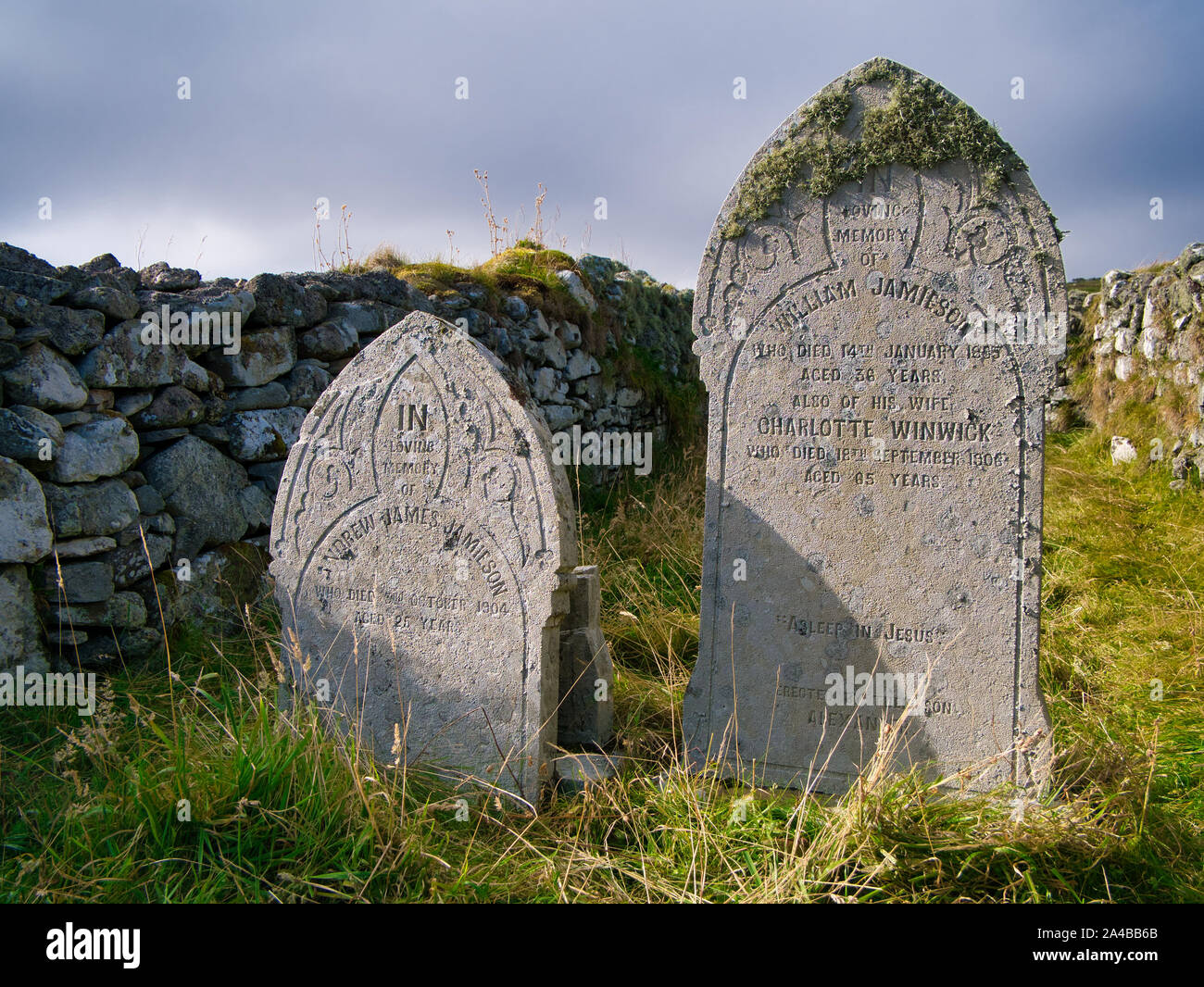 Old graves of the Jamieson family in a remote graveyard near Sandwick on the island of Unst in Shetland, Scotland, UK Stock Photo