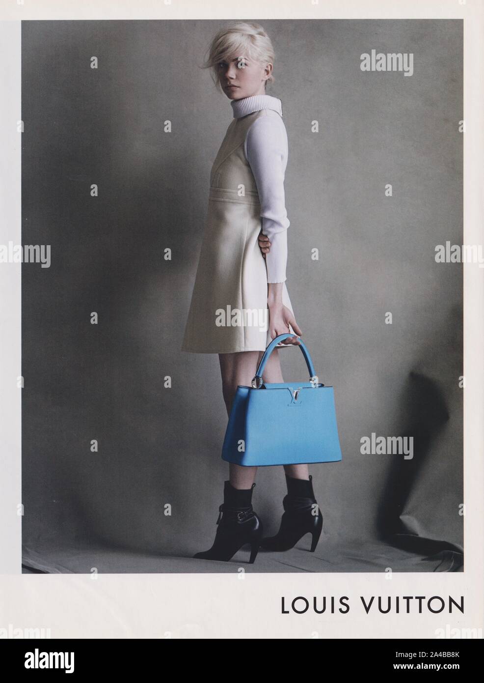 poster advertising Louis Vuitton with Charlotte Gainsbourg in paper magazine  from 2014 year, advertisement, creative LV Louis Vuitton 2010s advert Stock  Photo - Alamy