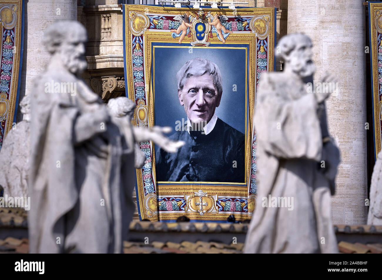 Vatican City, Vatican City. 13th Oct, 2019. Tapestry portraying Cardinal John Henry Newman hangs from the façade of St. Peter's Basilica as Pope Francis celebrates Canonization Mass for Britain John Henry Newman, Italian Giuseppina Vannini, Indian Maria Teresa Chiramel Mankidiyan, Brazilian Dulce Lopes Pontes, and Swiss Margarita Bays on Sunday, October 13, 2019, in Saint Peter's Square at the Vatican. Photo by Sefano Spaziani/UPI Credit: UPI/Alamy Live News Stock Photo