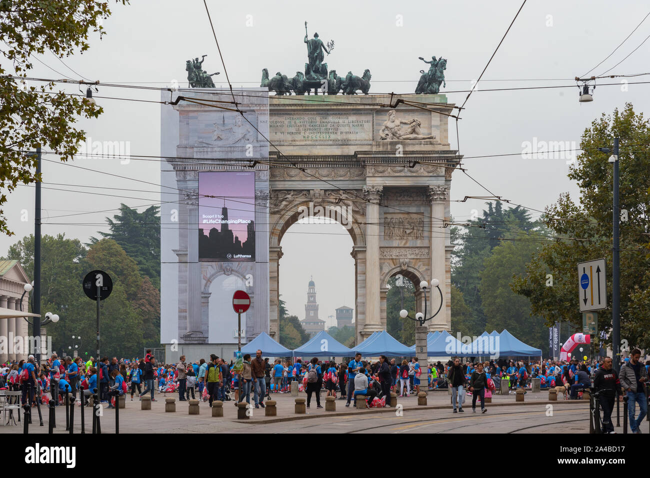 MILAN, ITALY - OCTOBER 13 2019: Athletes celebrate the end of the Deejay Ten at the Arco della Pace, a running event organized by Deejay Radio for the Stock Photo