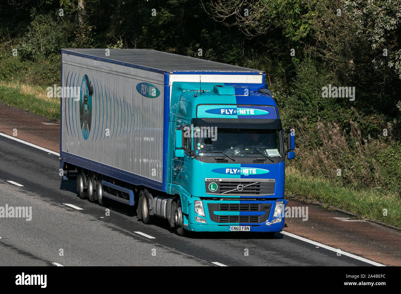 Fly BY Nite transport and logistics Volvo globetrotter traveling on the M61 motorway near Manchester, UK Stock Photo