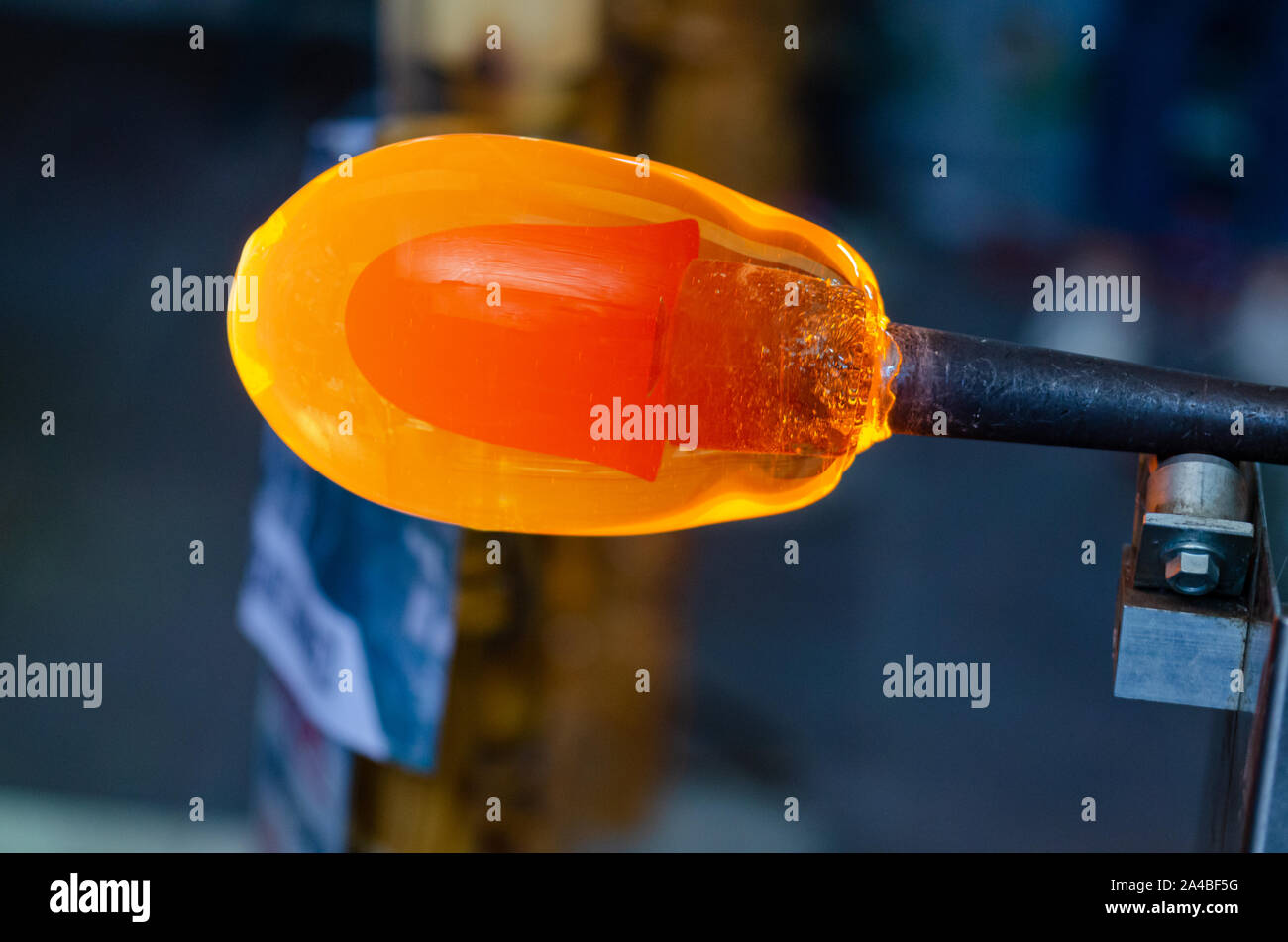 Glass blower manufacturing process, moment of cooling the glass at a glass makers Stock