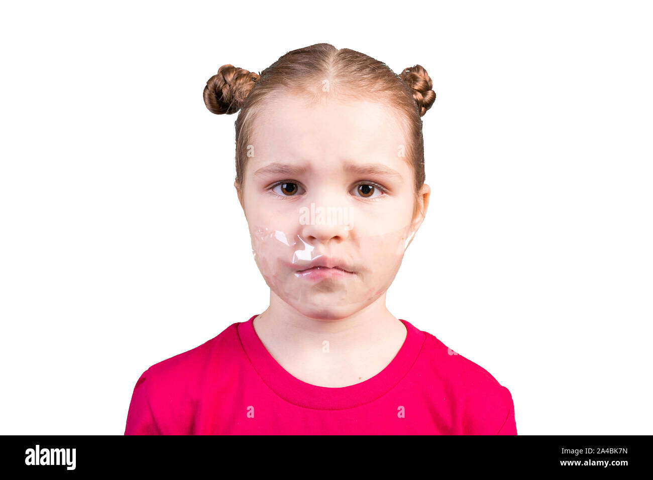 Girl with a sealed mouth. Isolated on a white background. Stock Photo