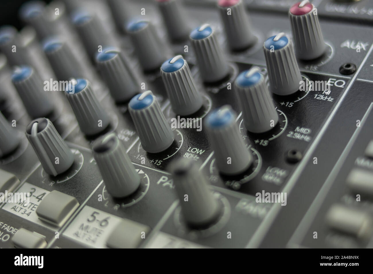 Set of equalizer knobs of a mixing table in the foreground Stock Photo