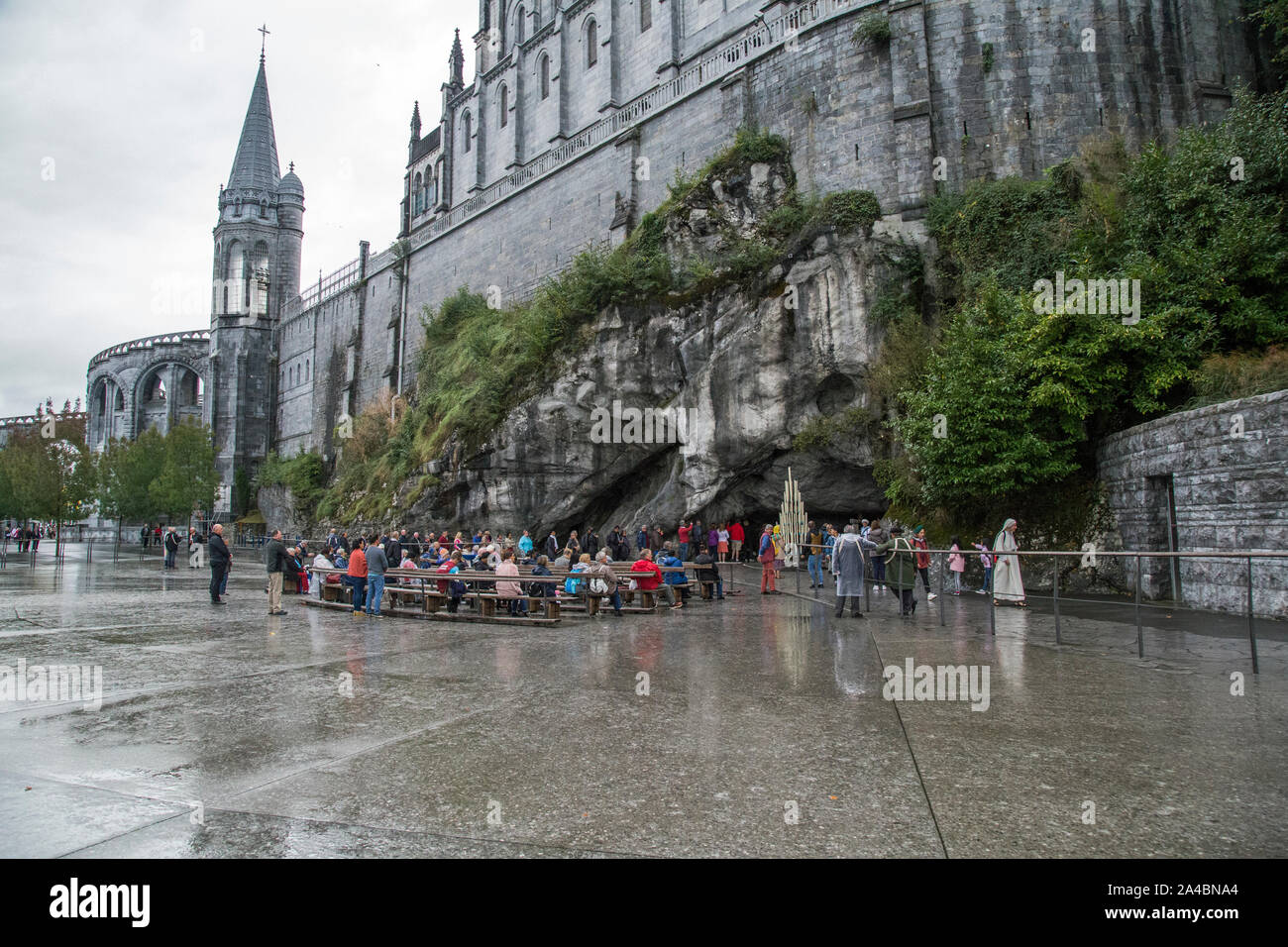 Lourdes, Aquitaine, France, October 2019, people visit the grotto near ...