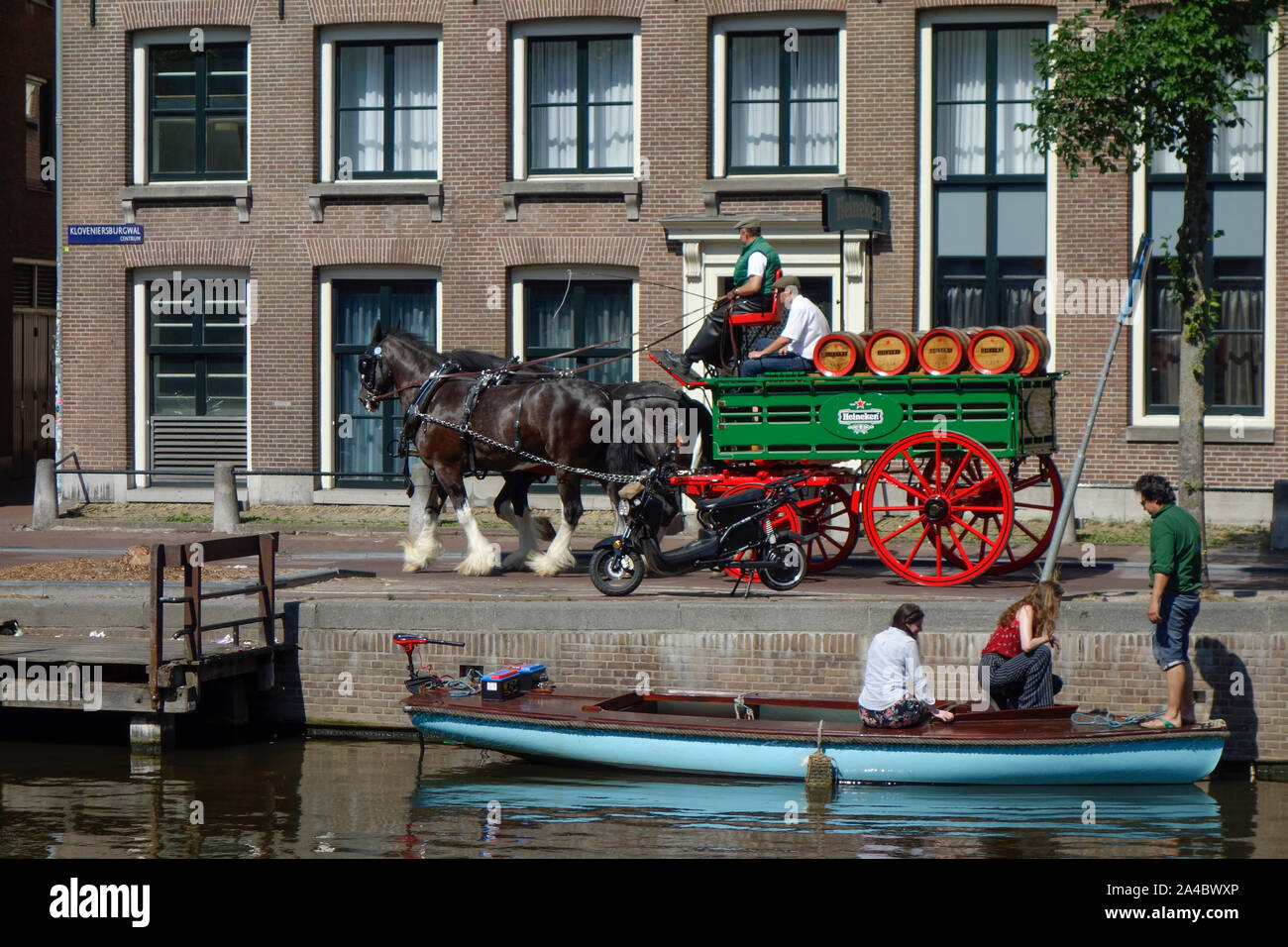 Heineken horse drawn Beer Wagon making deliveries in Amsterdam, The Netherlands. Stock Photo