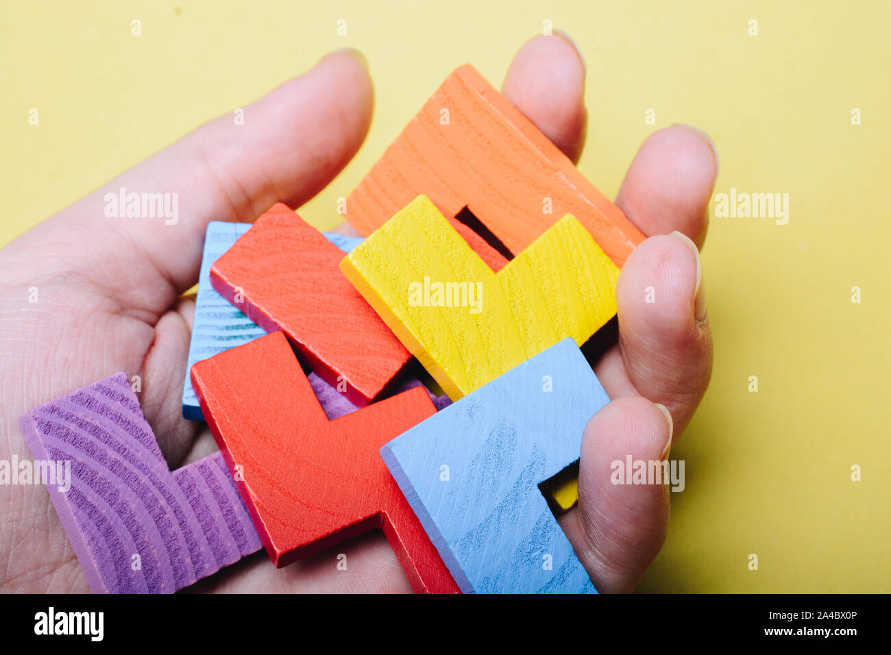 Piece of wooden colorful  puzzle as problem solving concept Stock Photo