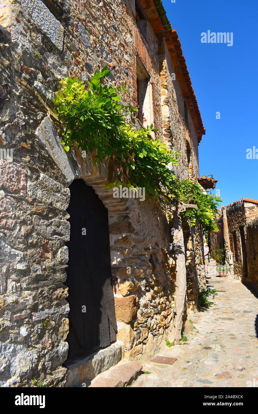 Authentic cobblestone street in medieval mountain town in the Pyrenees ...