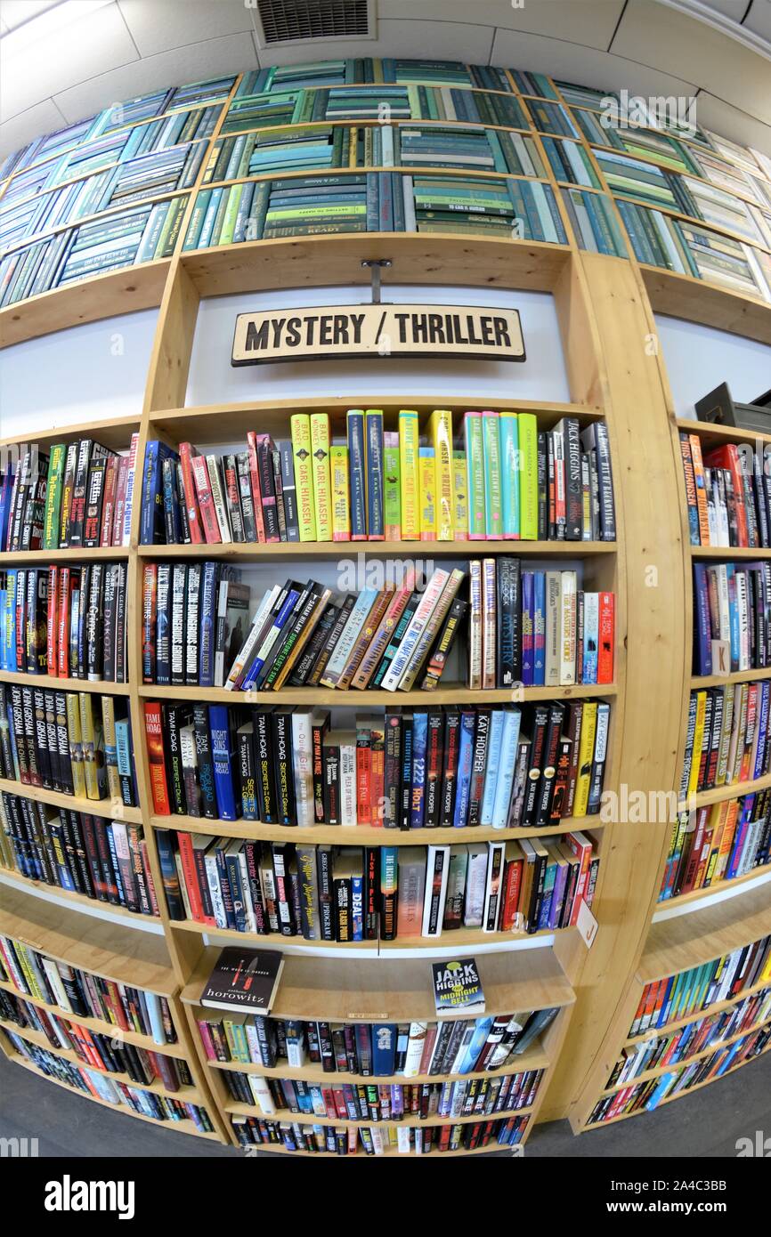 New and Used bookstore in Bend Oregon with selection of all kinds in neat order on shelves and in windows for great prices and are clean and orderly Stock Photo